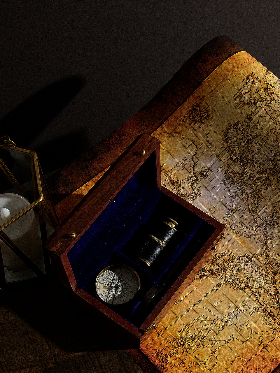 Wooden Box with Antique Telescope, Compass, and Magnifying Glass