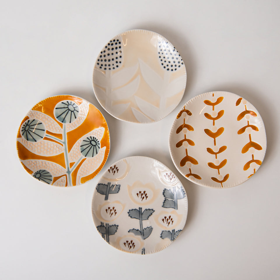 Hand-Painted Plates with Floral Patterns