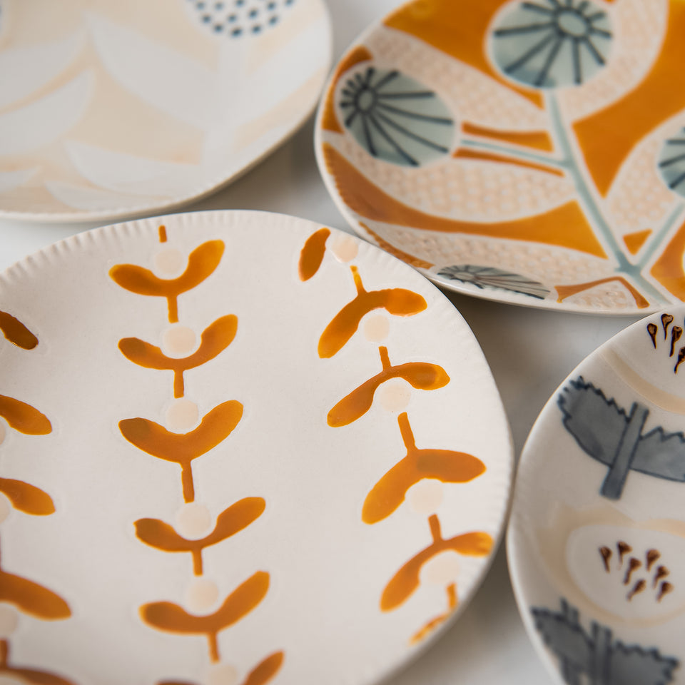 Hand-Painted Plates with Floral Patterns